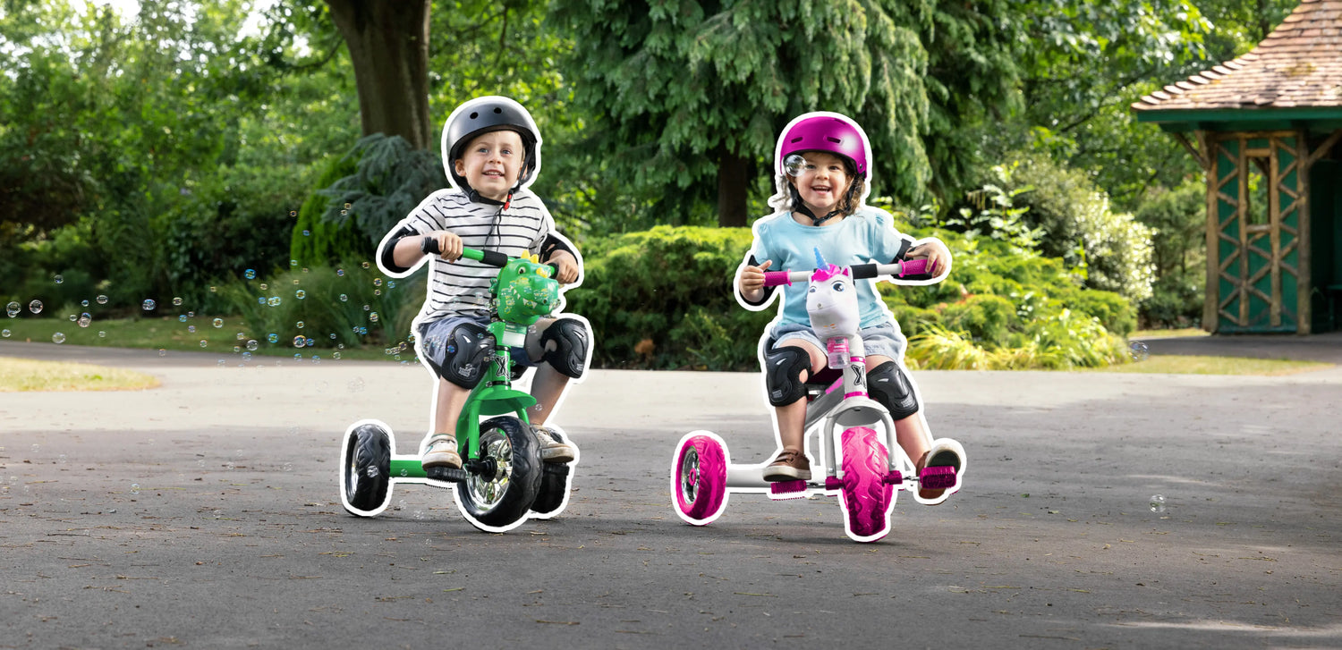 Two children riding trikes in the park enjoying outdoor summer play and active fun