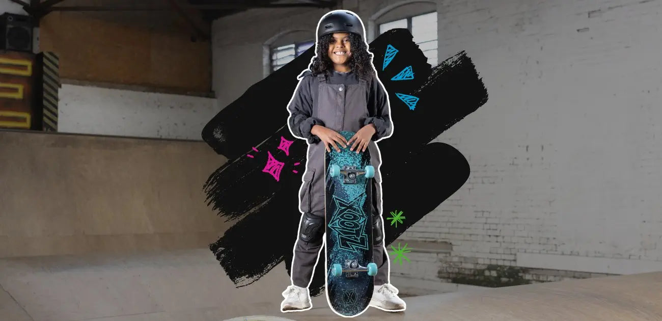 A young girl smiling and holding a skateboard