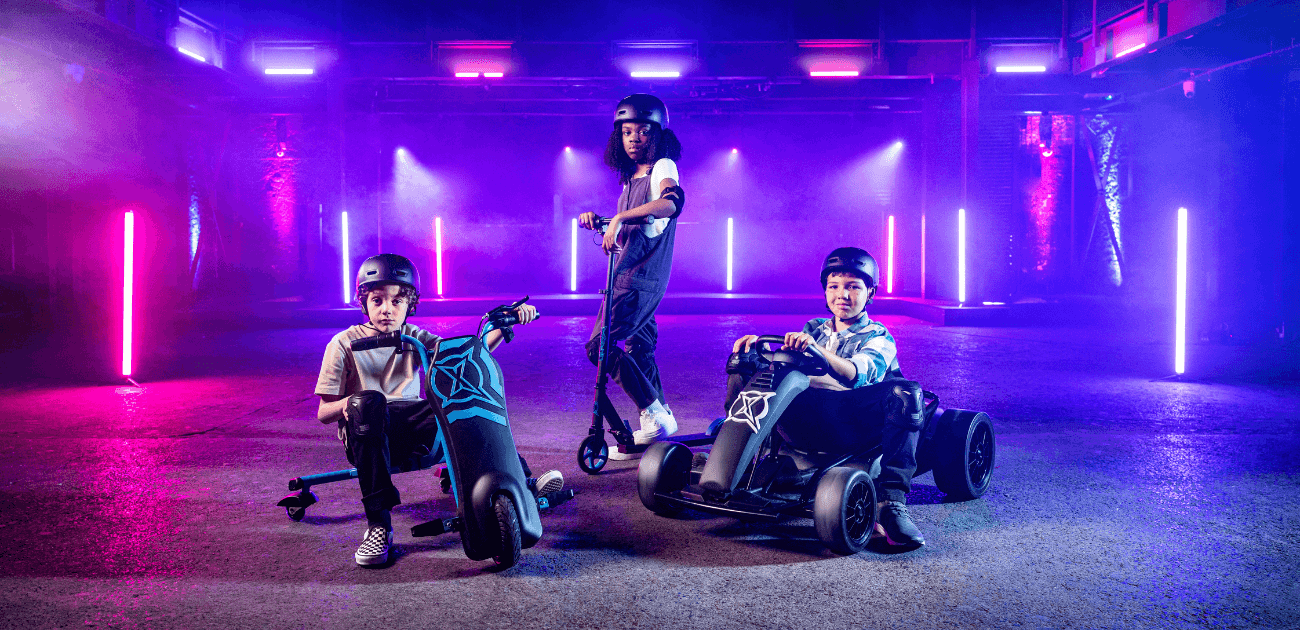 Three kids riding Xootz electric ride-ons inside , highlighting safe play for children.