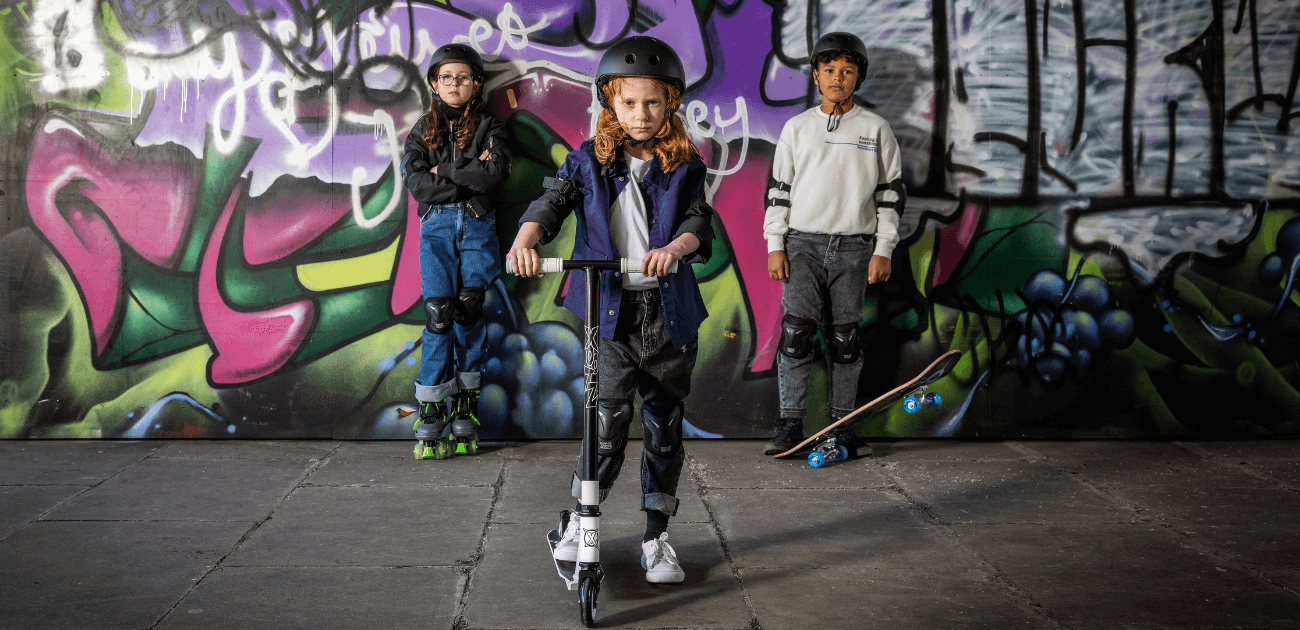 Children playing with Xootz scooter, skateboard, and skates - active fun for the whole family.