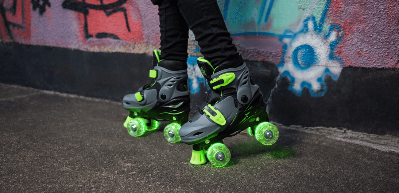 LED roller skates glowing against a graffiti wall - one of our top Christmas gift picks for 2023.