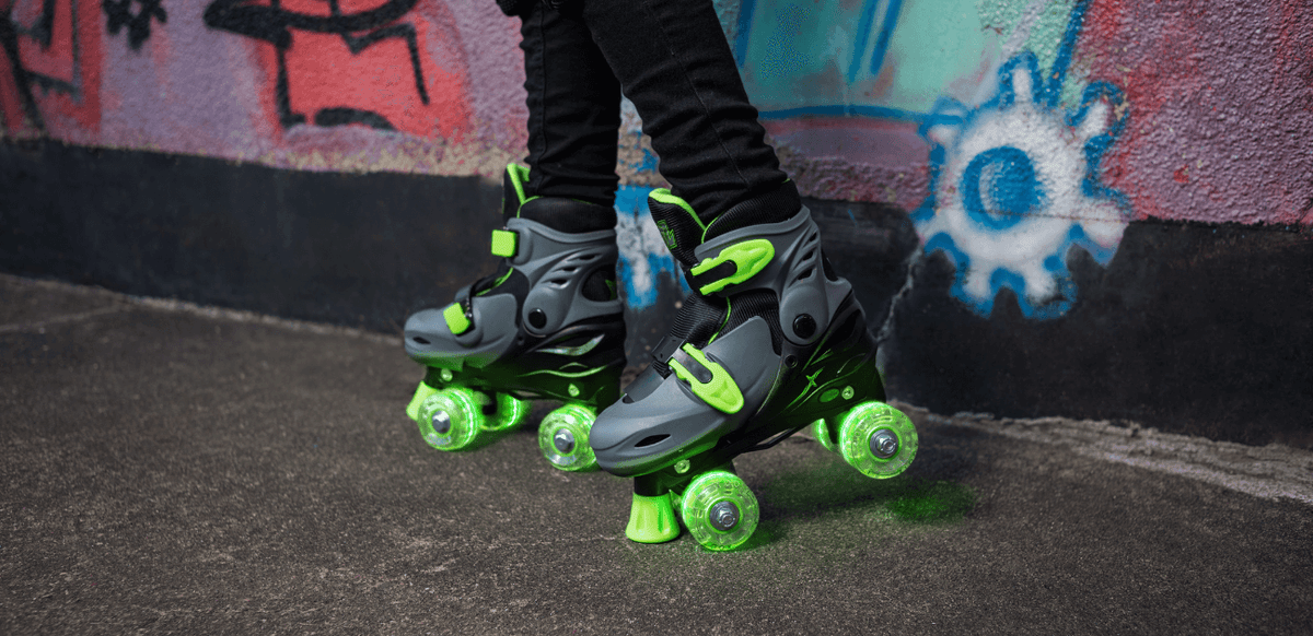 LED roller skates glowing against a graffiti wall - one of our top Christmas gift picks for 2023.