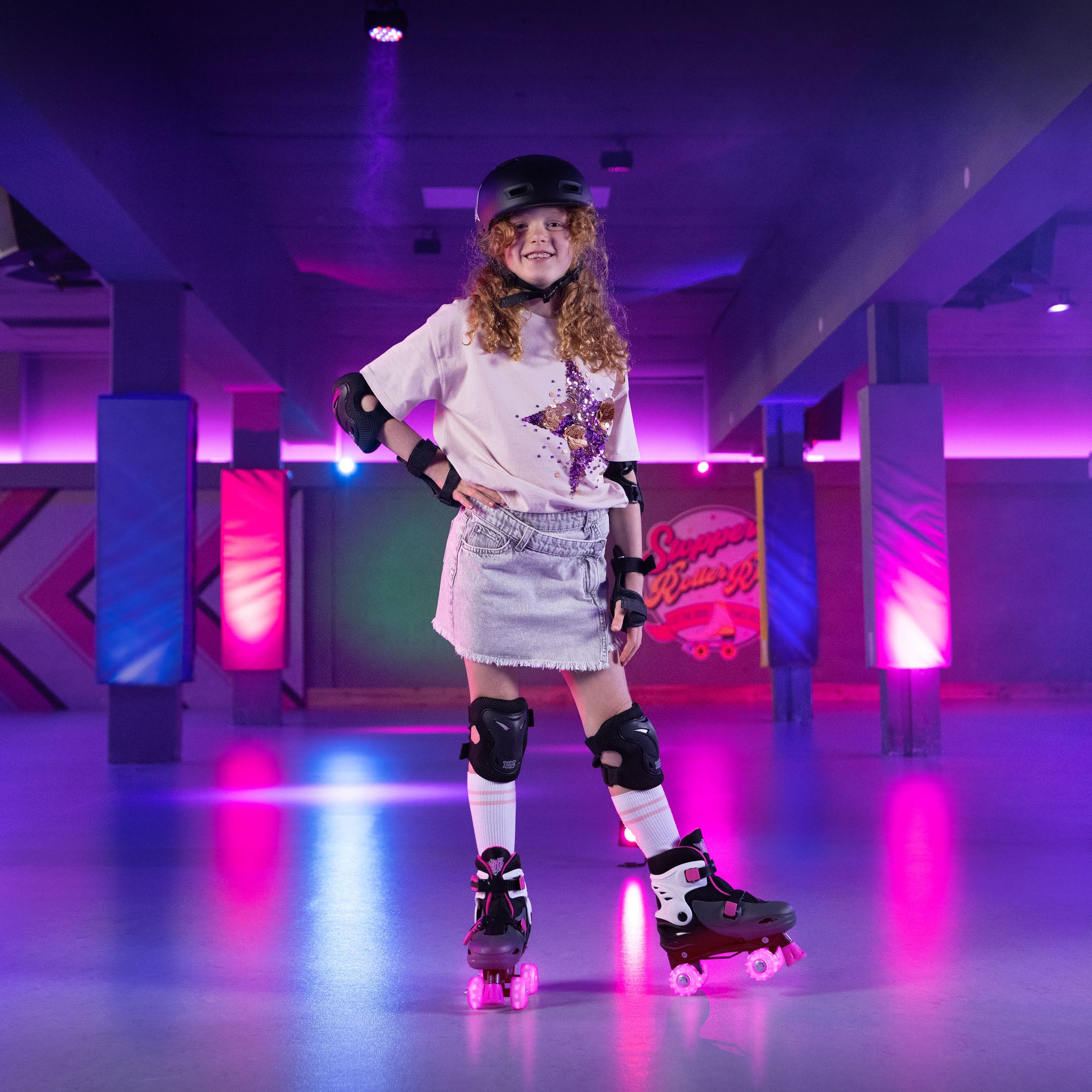 Person roller skating in a vibrant indoor setting with colorful lights.